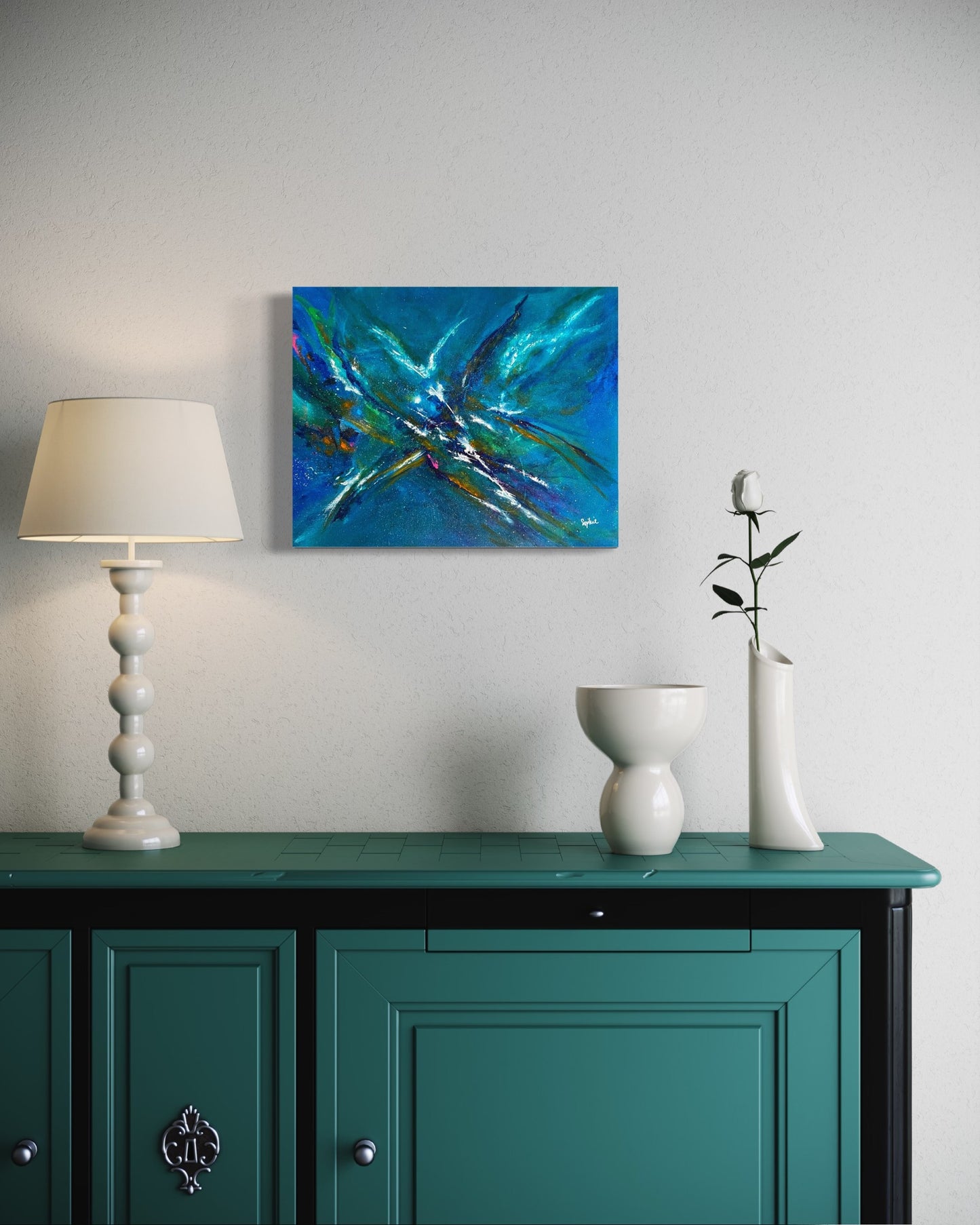 toile allégresse au dessus d'une table console