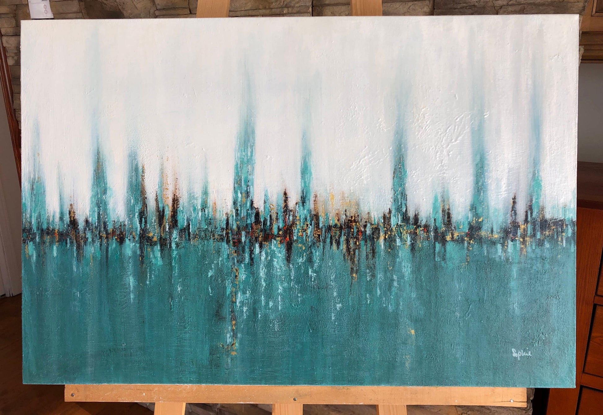 toile réflexions marines sur un chevalet